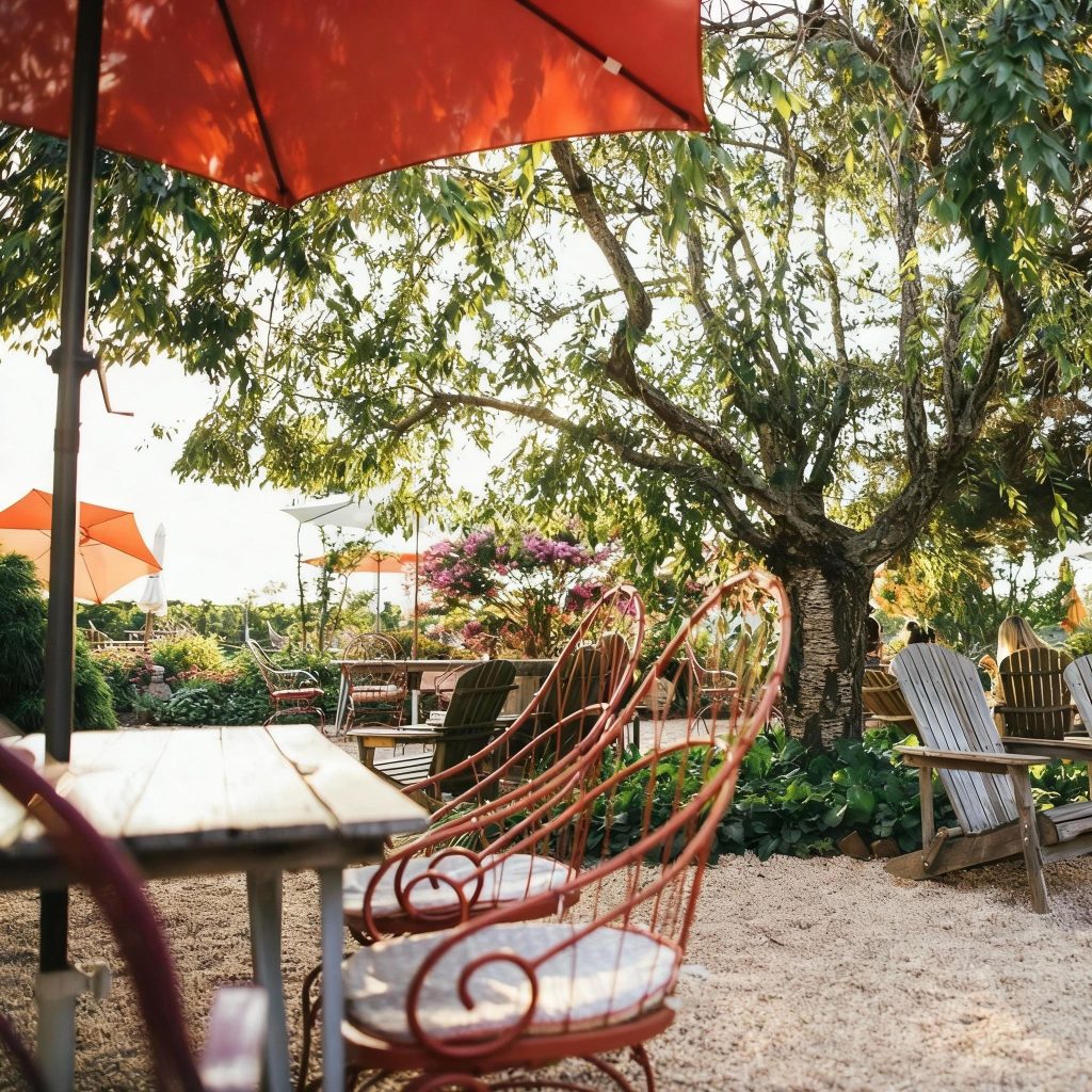Outdoor garden seating with tables and umbrellas at Croteaux Vineyards on the North Fork of Long Island during a Long Island wine tour.