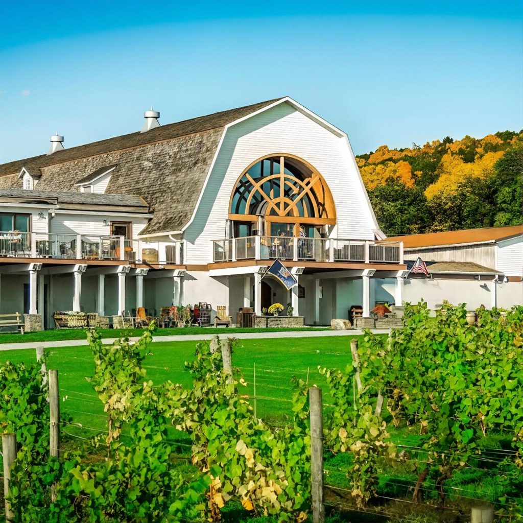 View of the winery house at Millbrook Vineyards from the vineyard during a chauffeured wine tasting tour from New York City.