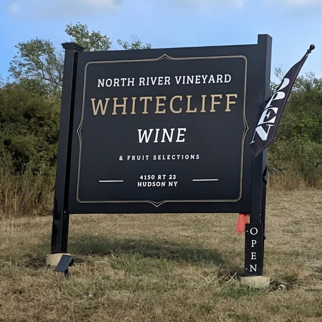 Entrance sign for Whitecliff Vineyard at Hudson in the Hudson Valley during a chauffeured wine tasting tour from New York City.